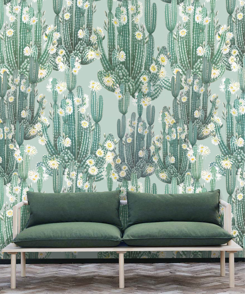 San Pedro Wallpaper Aqua • Cactus Wallpaper • Succulents Wallpaper • Desert Wallpaper Insitu behind sofa with green cushions