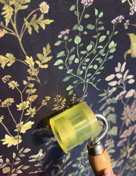 using a seam roller on Herbarium Herb Wallpaper