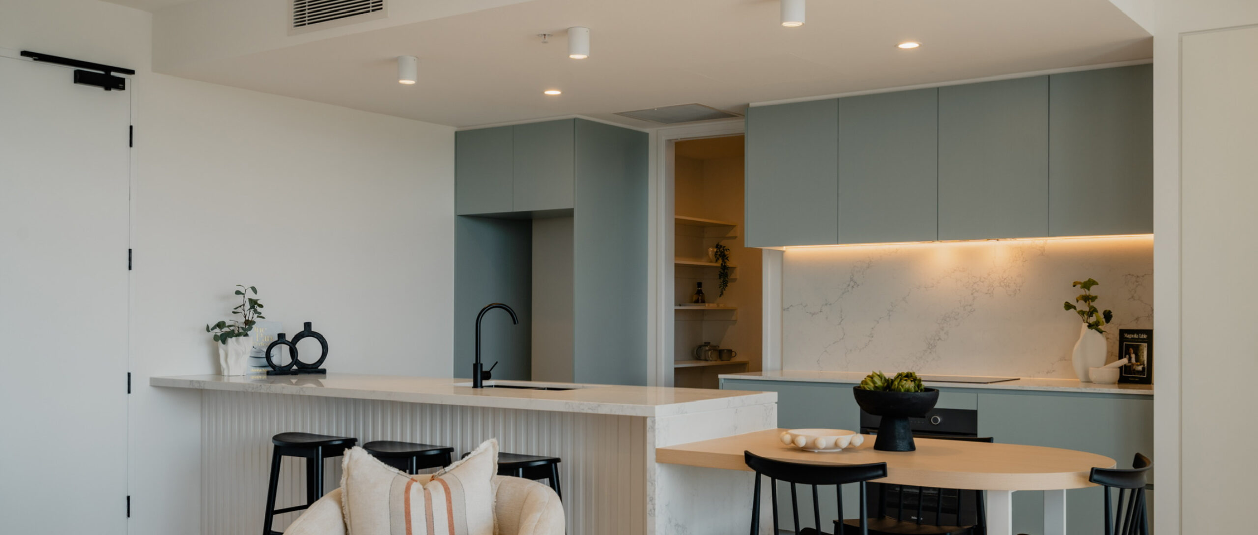 Whitewall Interiors open living room and kitchen