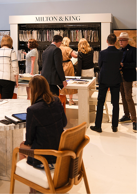 Interior of a furniture showroom with people looking at wallpaper samples